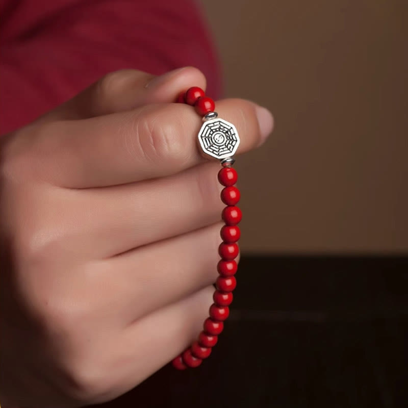 925 Sterling Silver Yin Yang Bagua Cinnabar Bracelet – Red beaded bracelet on hand, close-up wear shot, red garment