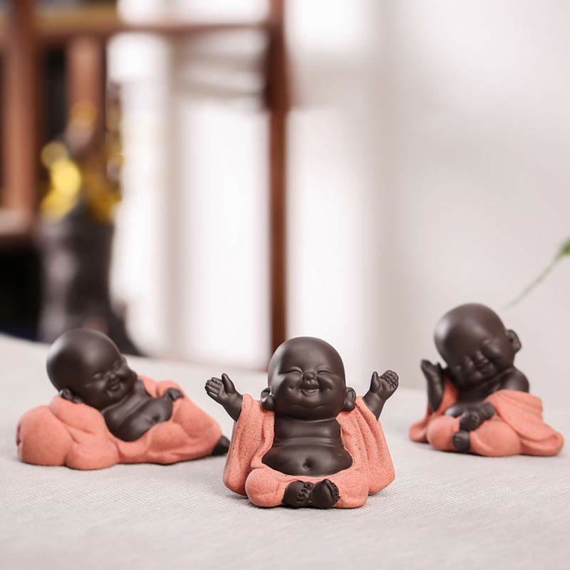 Laughing Buddha Purple Clay Maitreya Statue – rear three-quarter view showing coarse pink robe texture and smooth dark head silhouette, artisan craftsmanship