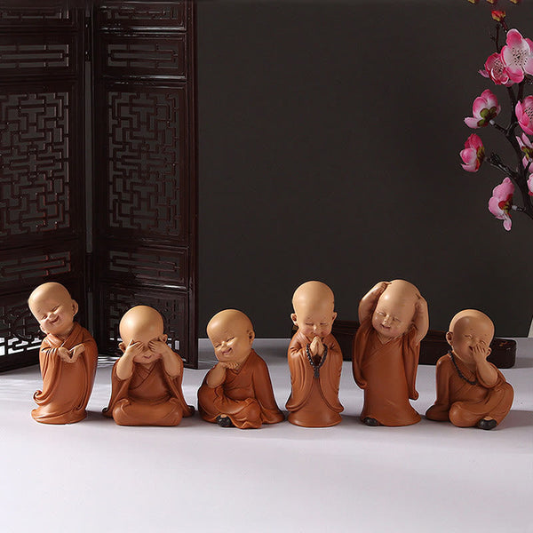 Mini Praying Monk Decor – row of identical monks in production finish check, quality consistency