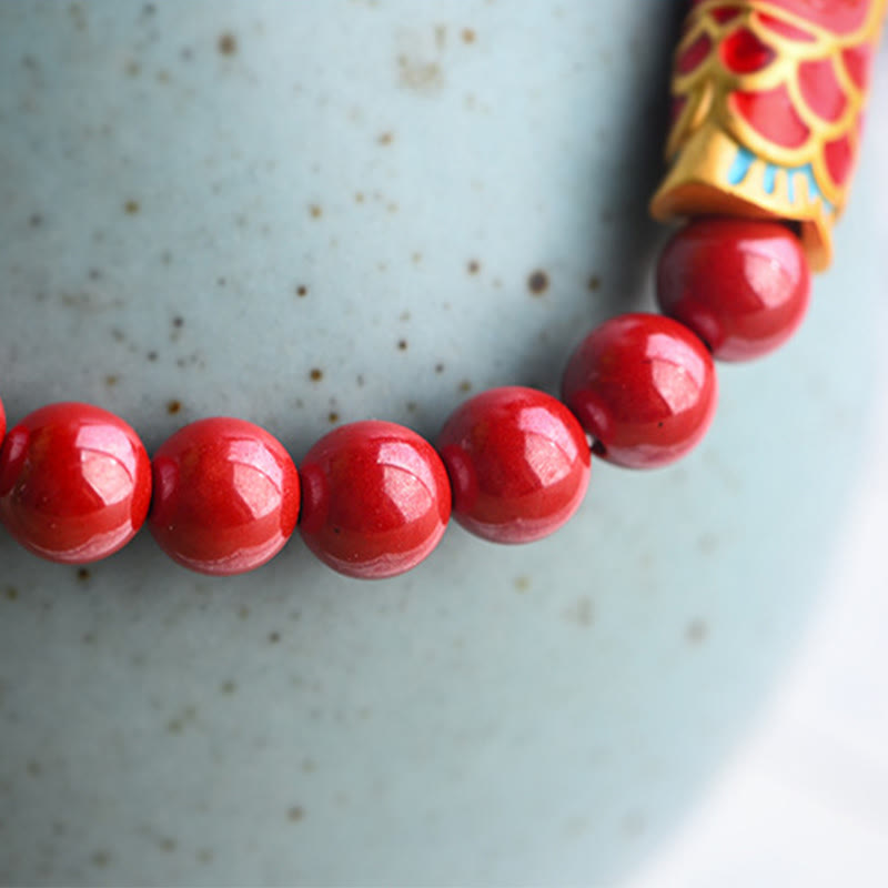 Strawberry Quartz Koi Bracelet – natural sunlight highlighting pink rose tones in quartz beads