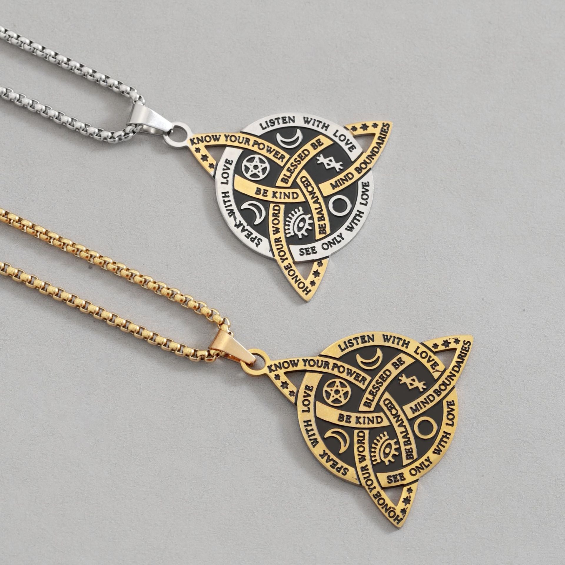 Celtic Moon Star Necklace – close-up gold and silver triquetra pendants on gray, engraved amulet