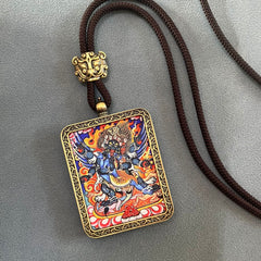 Tibetan Thangka Pendant – blue fierce protector with flaming aureole, gold scroll frame, brown cord, prosperity amulet