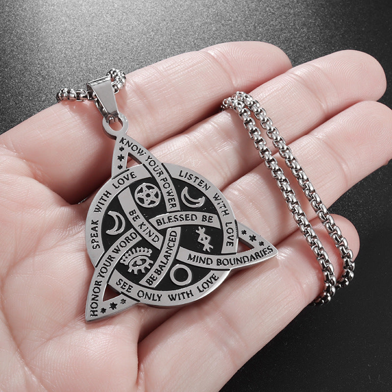 Celtic Moon Star Necklace – silver pendant in palm showing scale and detailed engraving, Celtic jewelry
