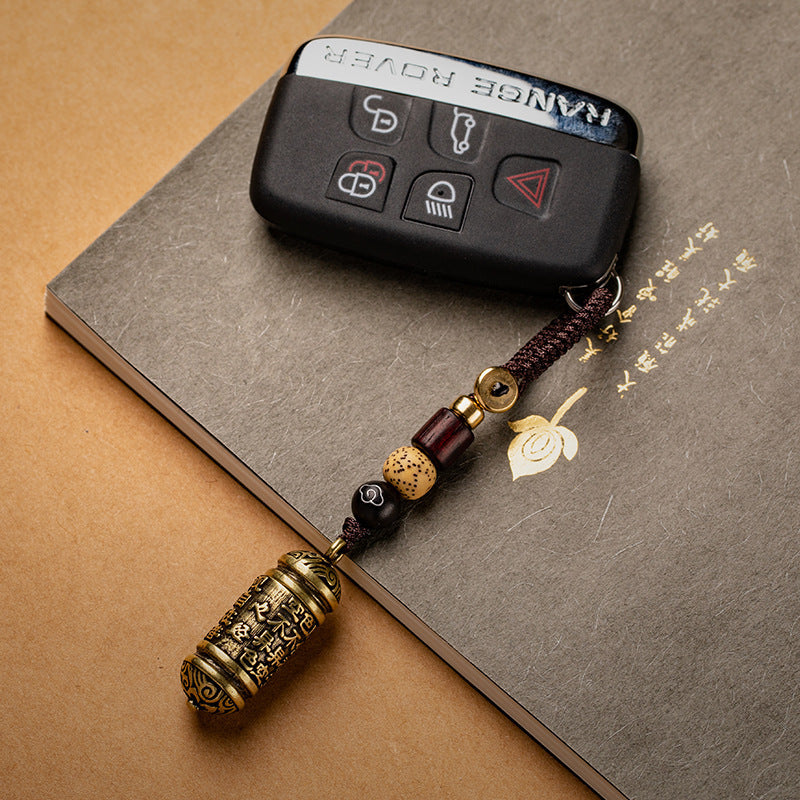 Tibetan Om Mani Padme Hum Brass Car Ornament, detail shot
