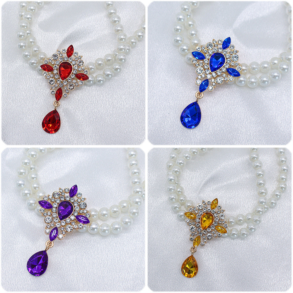 Elegant Pearl Crystal Collar – Close-up of red, blue, purple and yellow crystal pendants on pearl collars