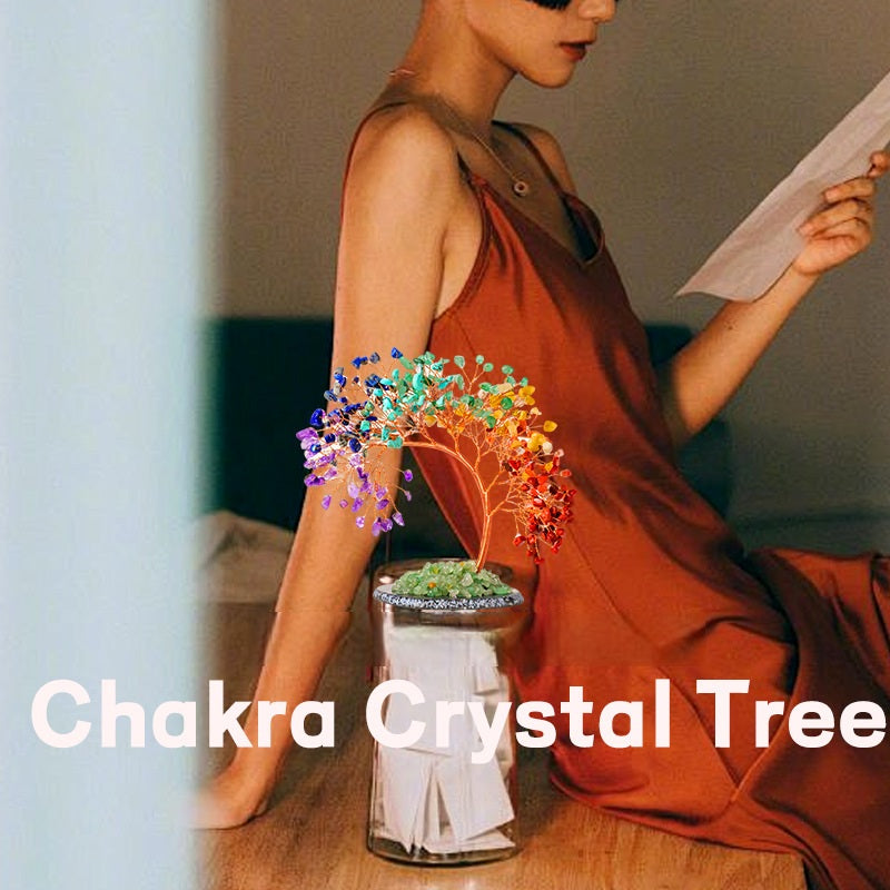 Chakra Crystal Tree – rainbow chakra tree on glass jar beside woman in brown dress, lifestyle setting, text overlay
