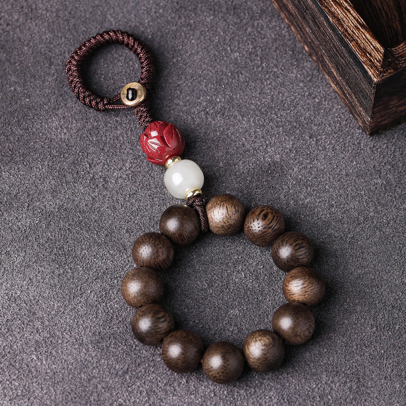 Agarwood & Hetian Jade Lotus Car Keychain, detail shot, lucky charm