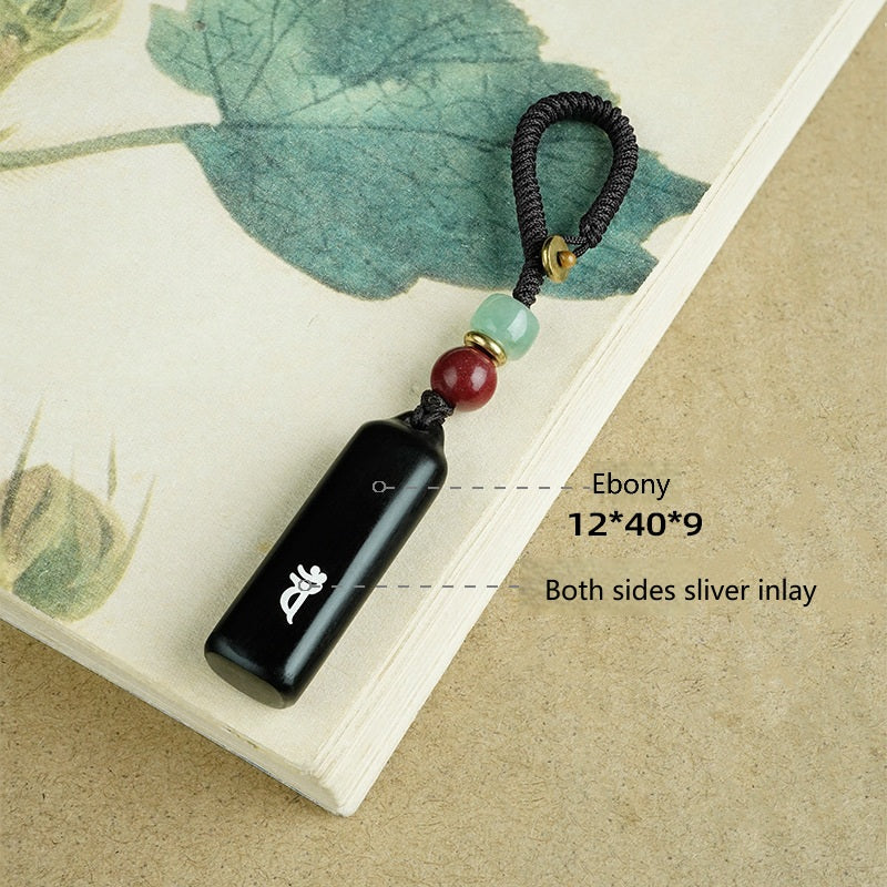 Ebony Eight Guardians talisman keychain with silver inlay for Dragon and Snake zodiac Buddhist protection