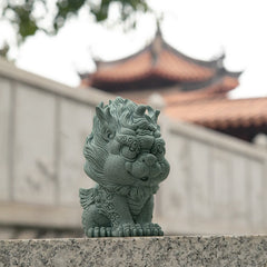 PiXiu Sandstone Statue – Front view with Chinese architecture and stone railing background, zen decor
