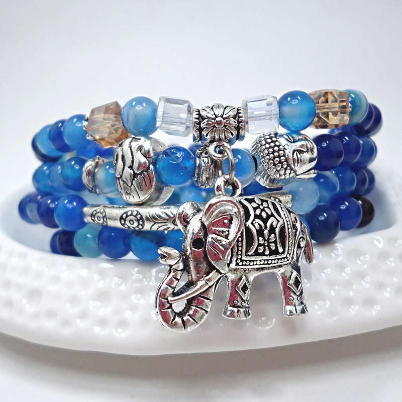 Natural Agate Elephant Buddha Bracelet – blue agate stacked on white dish with elephant charm, detail