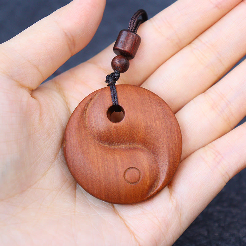 Lightning Struck Jujube Wood Yin Yang Luck Protection Necklace Pendant - Wood yin-yang in open palm, natural wood jewelry