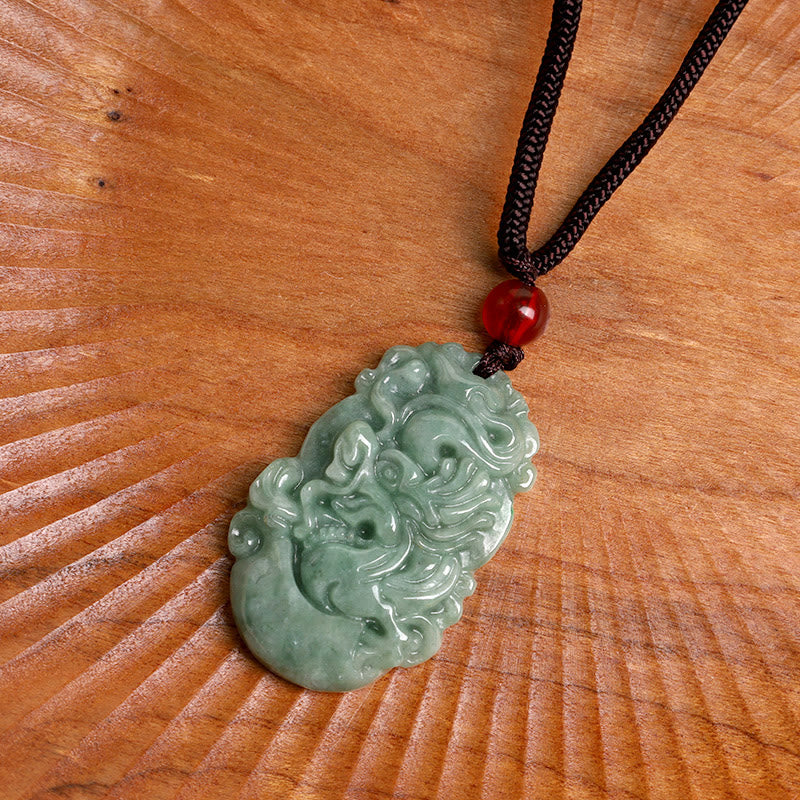 Jade Zodiac Prosperity Necklace – Dragon carving on radial wood grain, top-down view, heritage