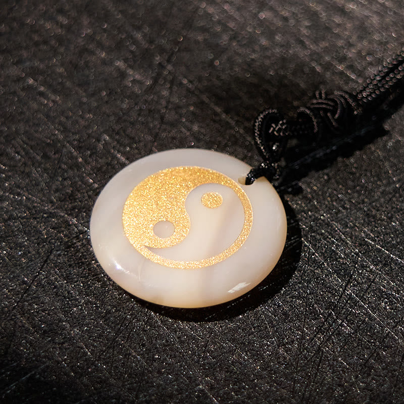 Yin Yang Crystal Necklace – Blue sodalite round pendant with gold glitter yin-yang symbol, natural gemstone with blue veining