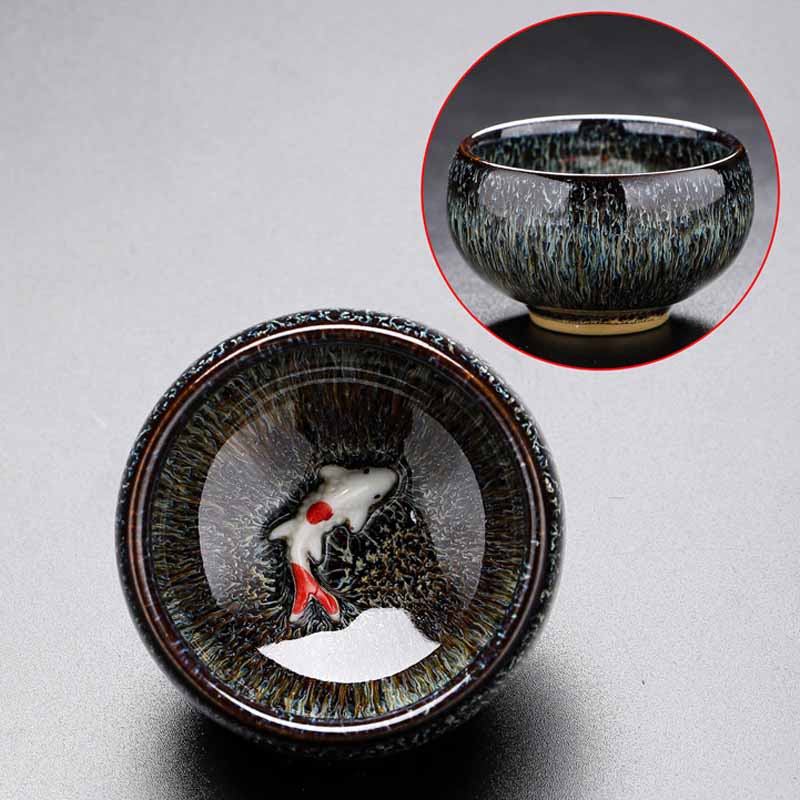 Jianzhan Koi Teacup – cup on bamboo tea tray in pouring position, kung fu tea set