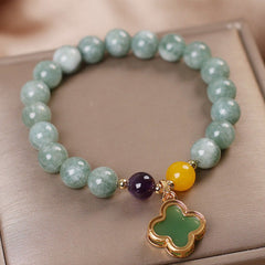 Natural green jade bracelet with purple amethyst and golden yellow jade beads, gold clover pendant, handmade gemstone charm jewelry for women