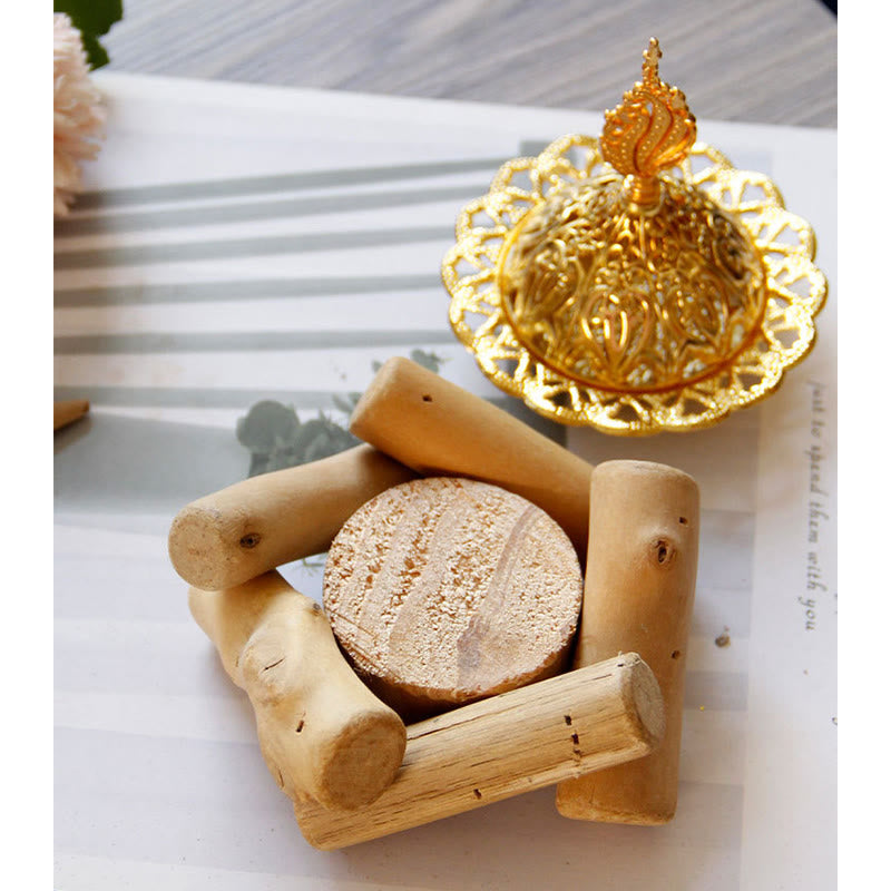 Gold Alloy Mini Incense Burner – filigree lid paired with driftwood stand on botanical striped paper, gold incense decor