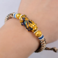 Feng Shui PiXiu Bracelet – color change Pixiu on wrist blue purple hue, adjustable rope, unisex
