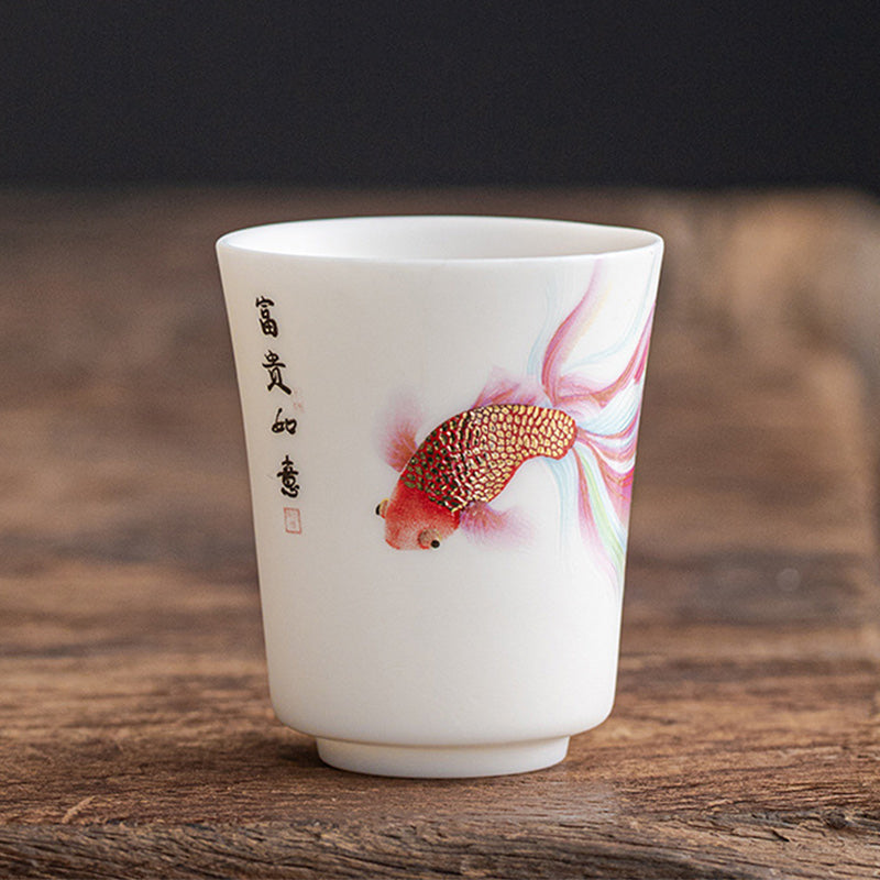 Koi Fish Porcelain Cup - tea ceremony setting with multiple cups on bamboo tray