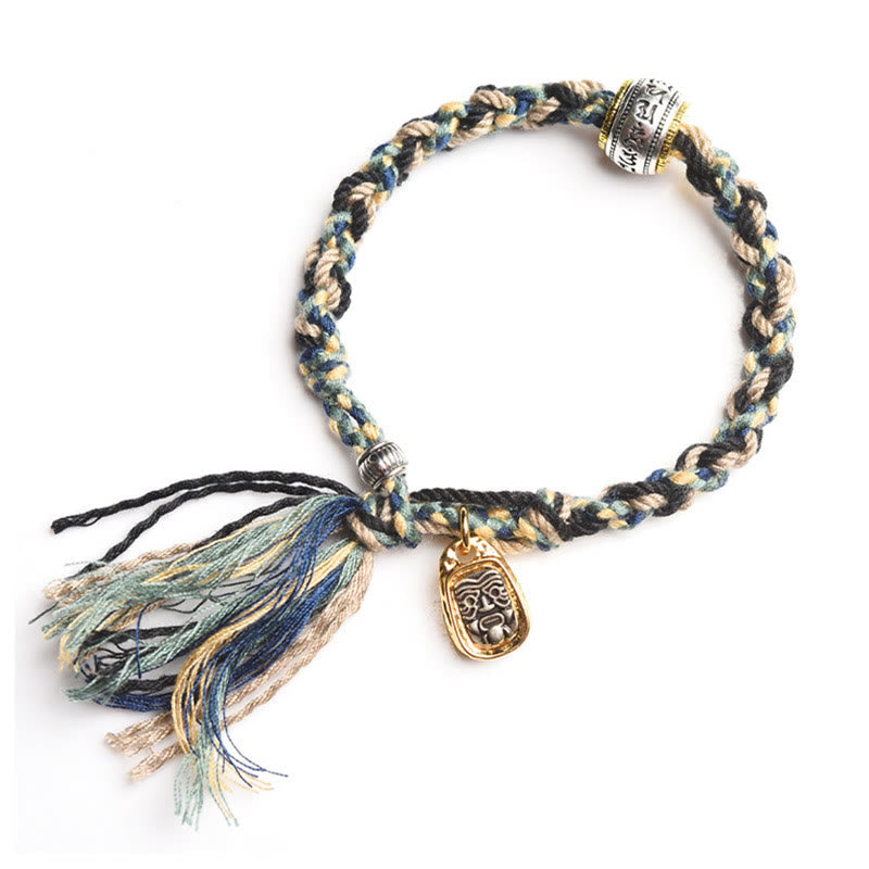 Zakiram Goddess Bracelet – White background flat lay showing engraved mantra bead and deity pendant, woven bracelet