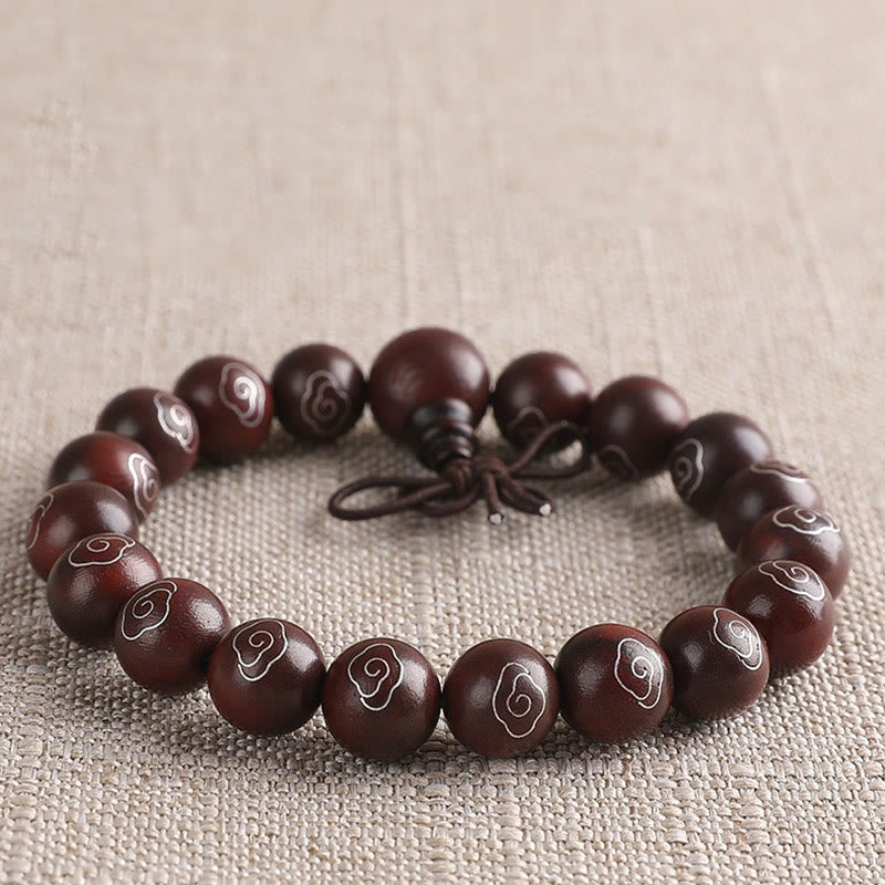 Sterling Silver Sandalwood Mantra Bracelet – flat lay of single loop with silver cloud inlay, Buddhist wrist mala