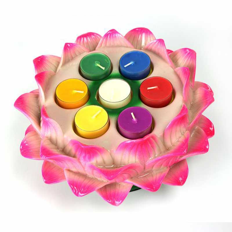Lotus Candle Holder – Seven unlit chakra tealights in pink lotus, overhead view, meditation
