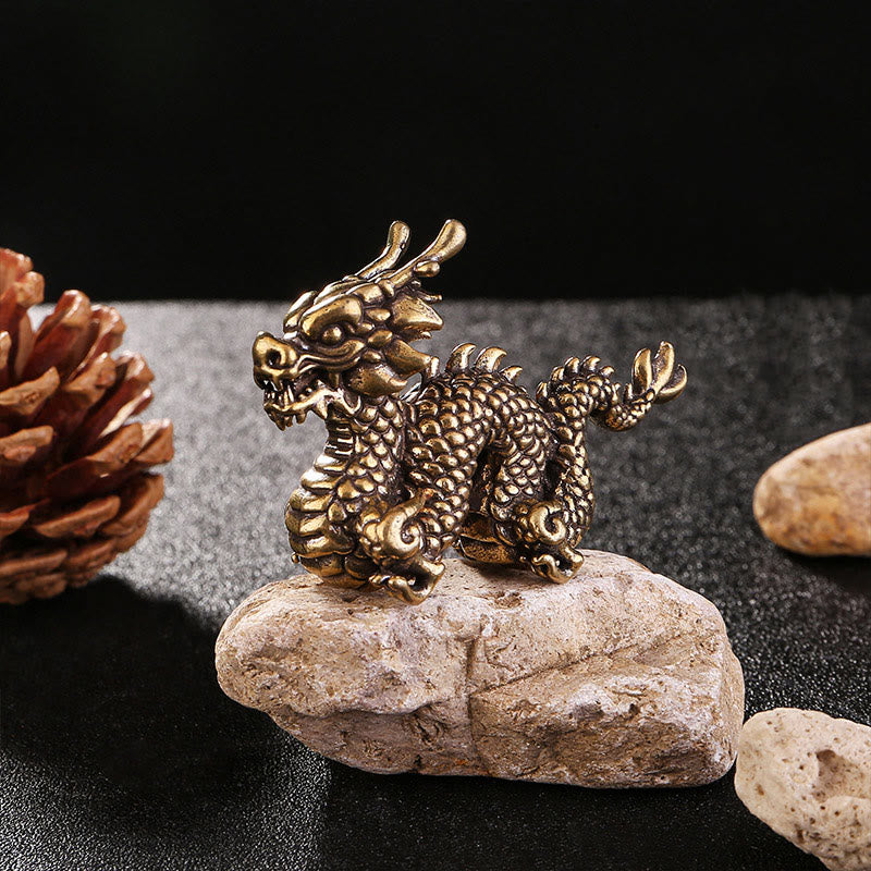 Auspicious Brass Dragon Decoration - Crouching dragon on rough stone with pine cone, artisanal collectible