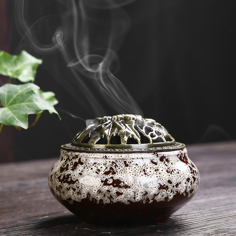 Flower Pattern Ceramic Burner – dark brown with cream speckled glaze and rising smoke, serene
