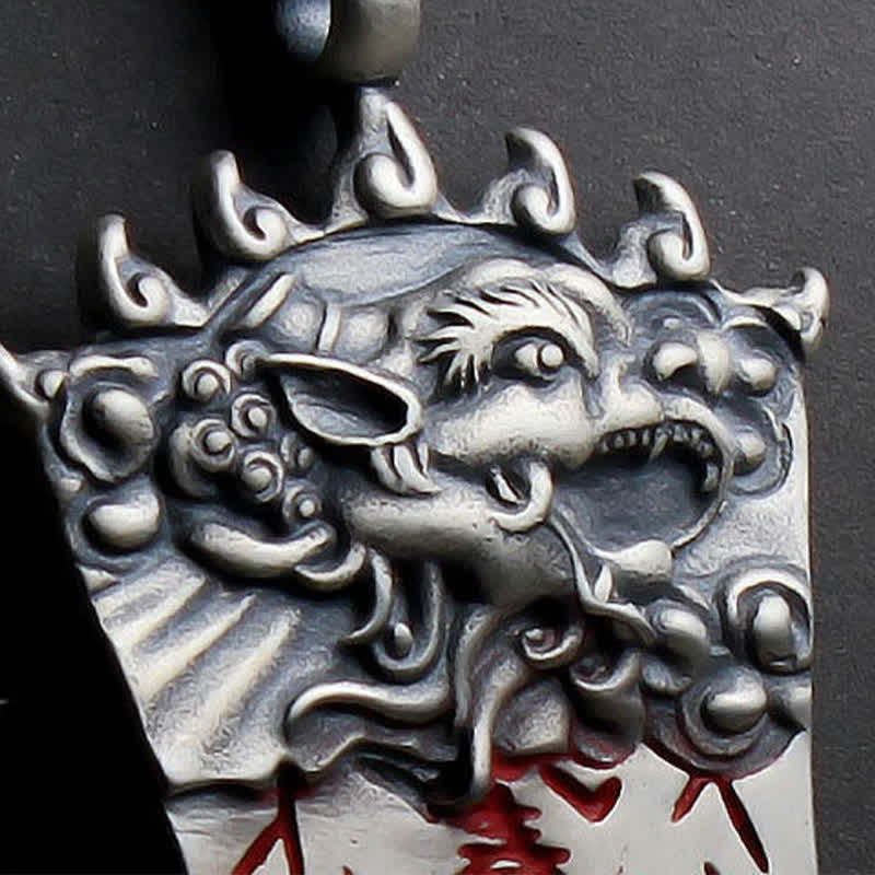 Bagua PiXiu Necklace – Close-up of silver PiXiu head carving with fierce detail and red accents, talisman