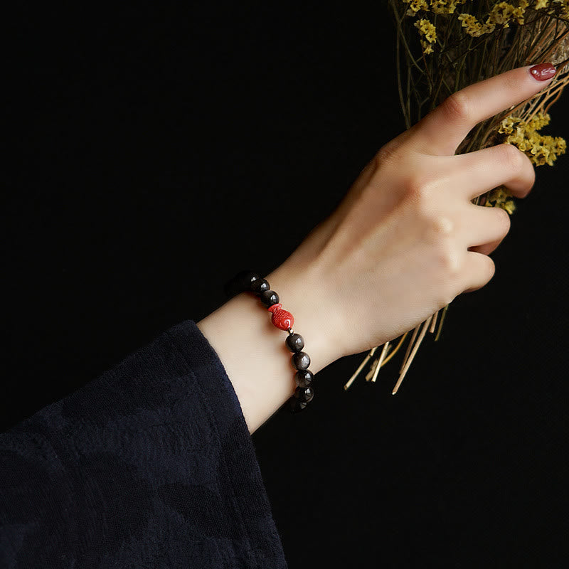 Silver Sheen Obsidian Koi Bracelet – worn on wrist, cinnabar charm, obsidian protection bracelet