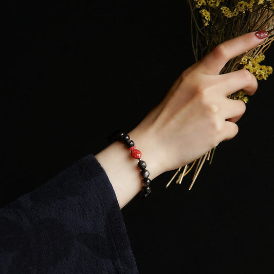 Silver Sheen Obsidian Koi Bracelet – worn on wrist, cinnabar charm, obsidian protection bracelet