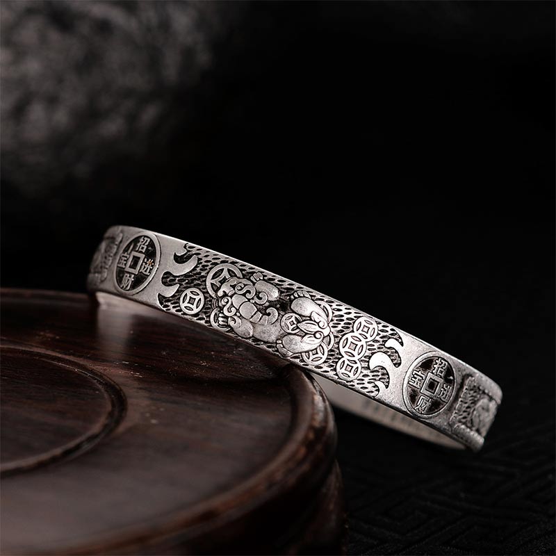 Sterling silver Pixiu wealth bracelet with bat and coin motifs, Zhao Cai Jin Bao inscription, Heart Sutra engraving and antique oxidized finish