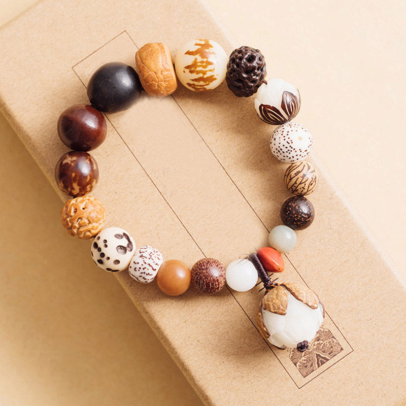Bodhi Seed Lotus Bracelet – On kraft packaging showing Wu character and lotus bead, mindful gift