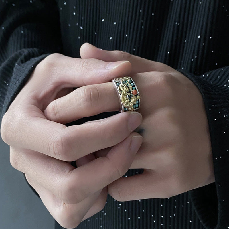 Silver PiXiu Ring – Worn on finger with black sequined outfit, hands clasped, statement protection jewelry