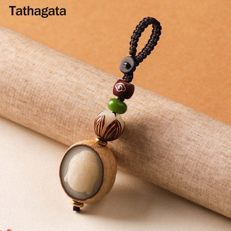 Bodhi Seed Blessing Keychain - carved Tathagata Buddha head in wooden frame with green jade and lotus beads on braided cord, wisdom