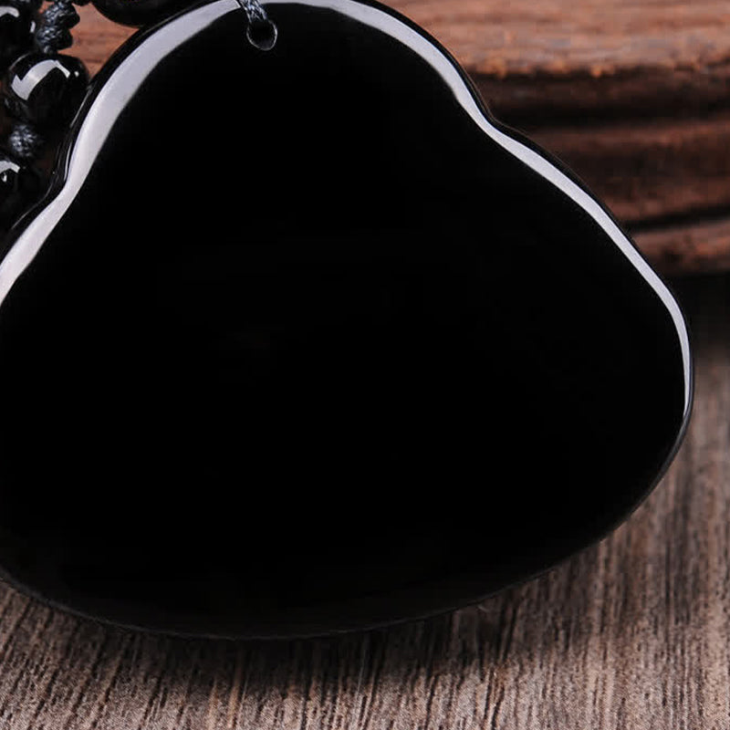 Black Obsidian Laughing Buddha Pendant – back view showing flawless polished obsidian surface, cleansing energy