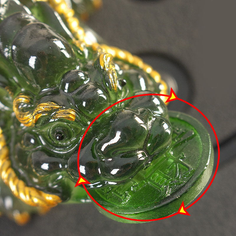 PiXiu Coin Tea Pet – Close-up of green PiXiu mouth coin detail with red highlight circle