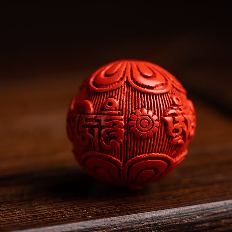 Tibetan Om Mani Padme Hum Sandalwood Cinnabar Protection Keychain – red cinnabar mantra bead close-up carving, protection charm