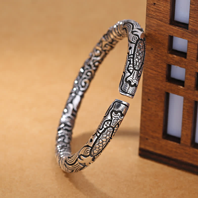Dragon Head Carved Luck Bangle – three-quarter view with dragon scale relief, Handcrafted