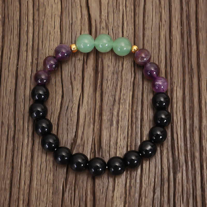 Amethyst Aventurine Lotus Mala - Color-block gemstone bracelet with gold accents on rustic wood, boho healing