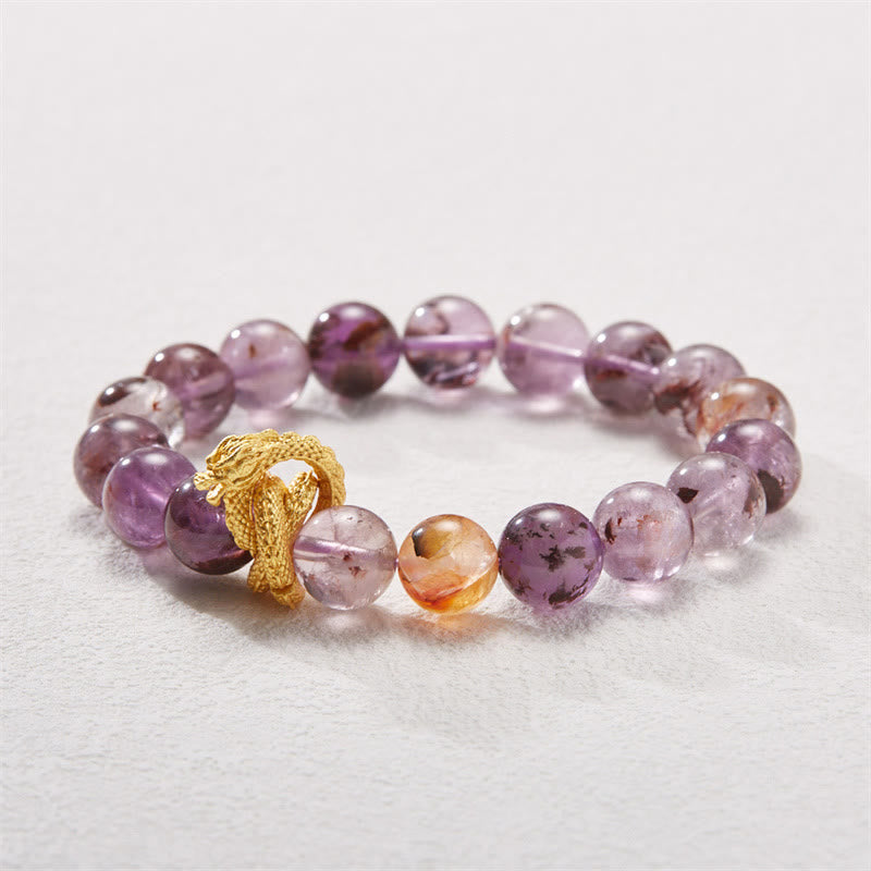 Purple Phantom Quartz Dragon Bracelet – Three-quarter view on gray surface with bicolor ametrine zones, inspiring