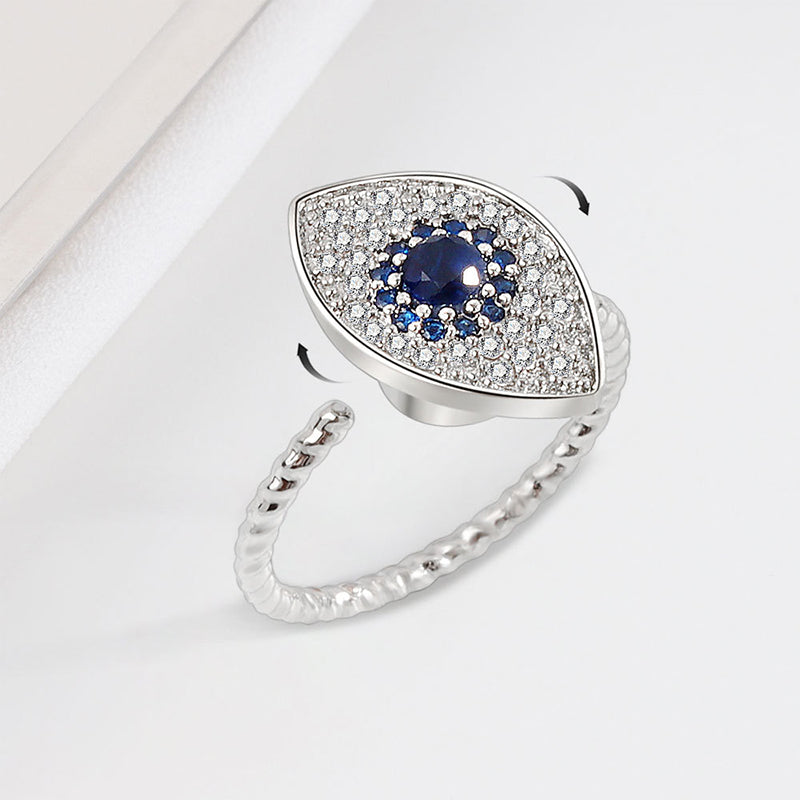 Evil Eye Rotatable Ring – Silver spinner ring with blue sapphire center, pave halo, twisted rope band