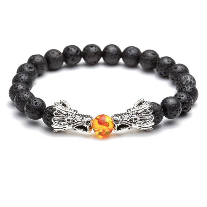 White Turquoise Lava Rock Dragon Bracelet – Front view black lava beads silver dragon charm amber center, Powerful