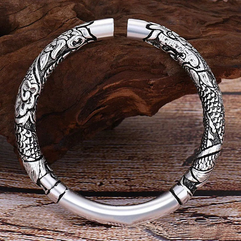 Dragon Auspicious Clouds Bangle – twin dragon cuff on natural wood prop, Heritage Craft