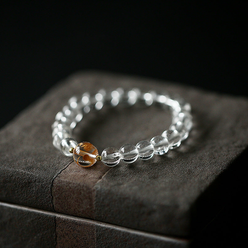 Black Obsidian White Crystal Onyx Dragon Bracelet - Transparent beads with amber inclusion on dark vintage books, Protection