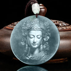 Kwan Yin Jade String Necklace – angled view of Guanyin relief on translucent green jade disc with bronze vessel prop, dark background, prosperity amulet