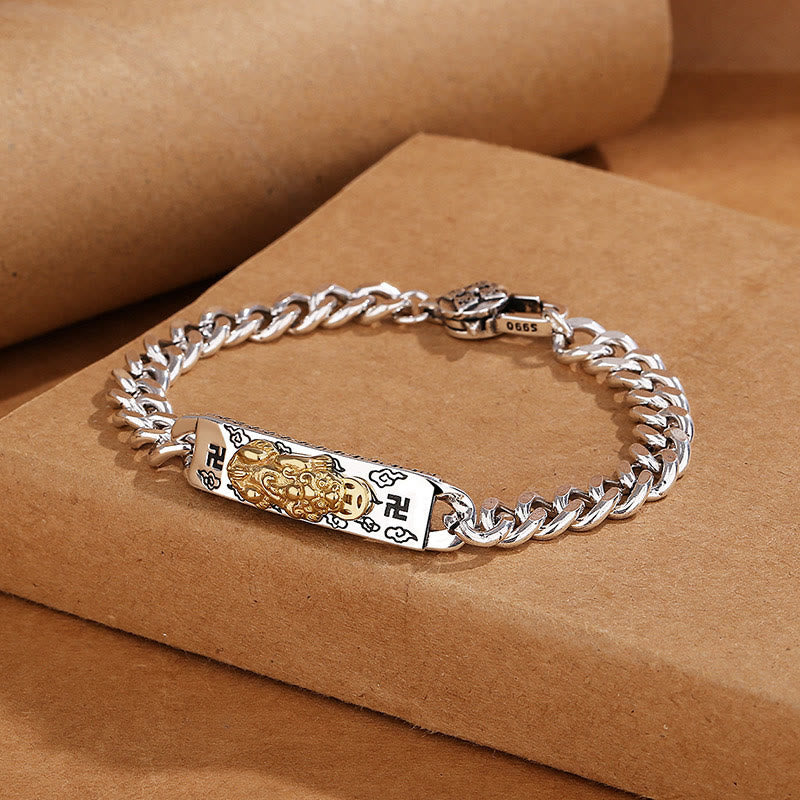 Om Mani Padme Hum PiXiu Swastika Wisdom Bracelet – silver bracelet on stacked brown boxes, lifestyle product shot