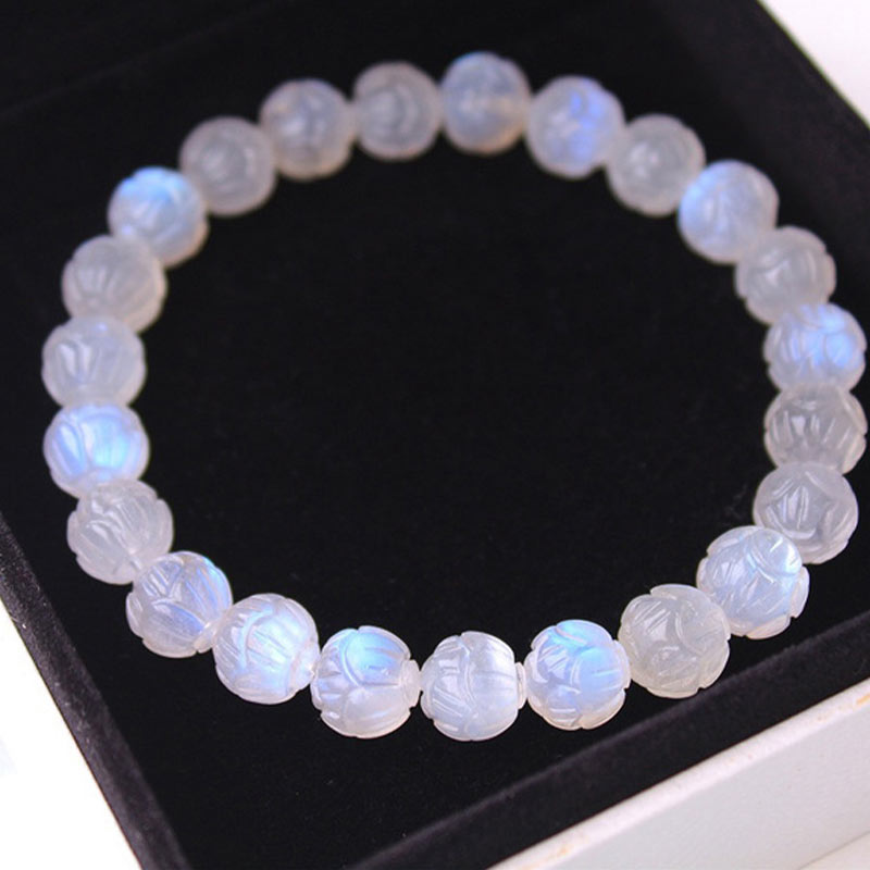 Natural Moonstone Lotus Love Bracelet - oval formation on black display, studio lighting