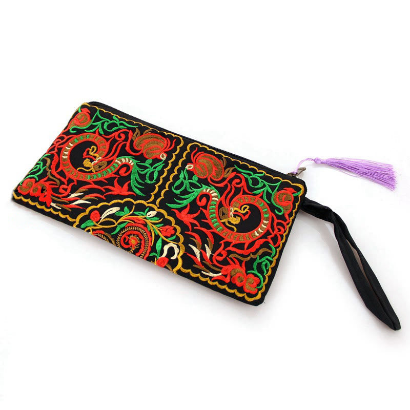 Dragon Butterfly Embroidery Wallet - 3/4 view of serpent embroidery with purple tassel, Artisan