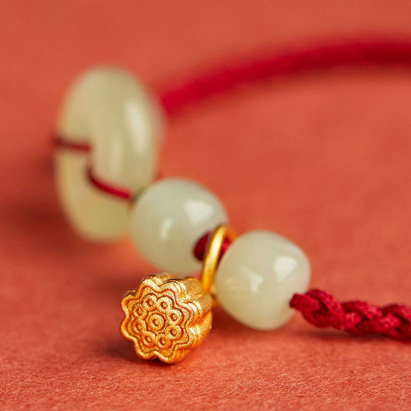 Jade Peace Buckle Lotus Bracelet – macro detail of gold lotus seed pod charm between jade beads, Abundance