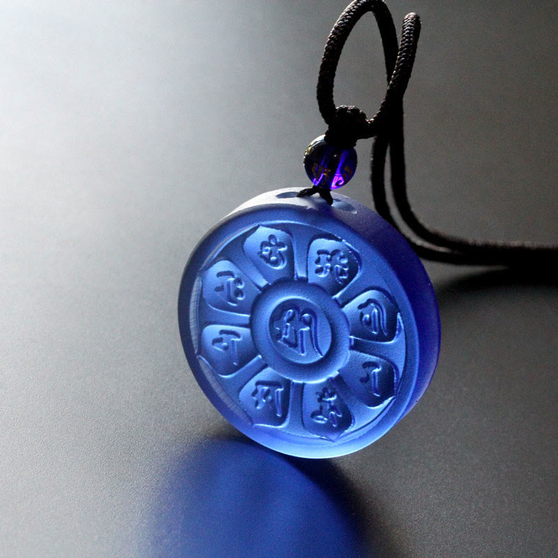 Liuli Manjusri Lotus Necklace - sapphire blue mantra disc with glowing translucent edges, spiritual